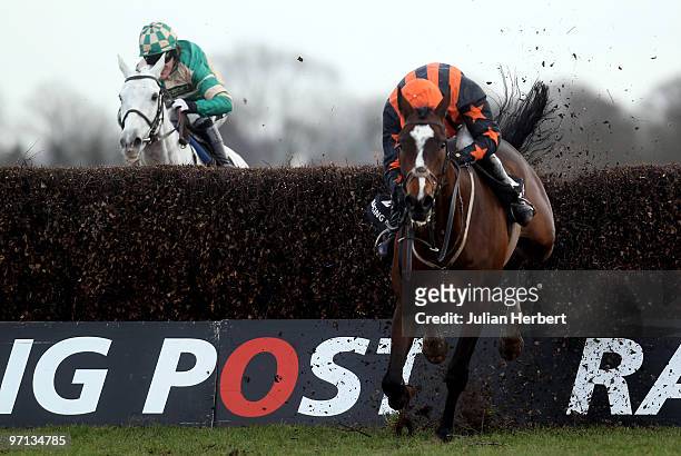 Paddy Brennan and Razor Royale lead the Tony McCoy ridden Nacarat over the last fence before going on to win The Racing Post Steeple Chase Race run...