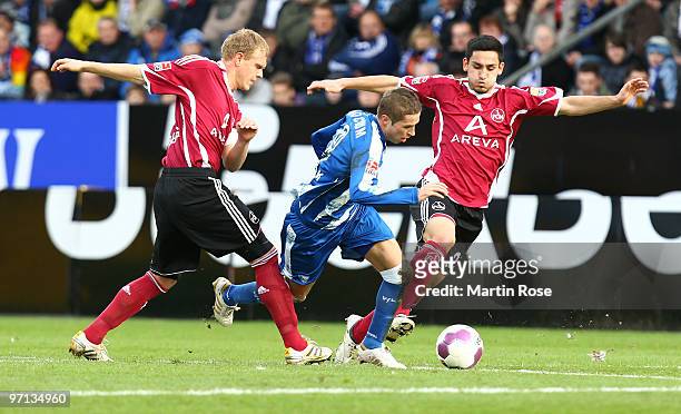 Stanislav Sestak of Bochum, Andreas Wolf and Ilkay Guendogan of Nuernberg compete for the ball during the Bundesliga match between VFL Bochum and 1....
