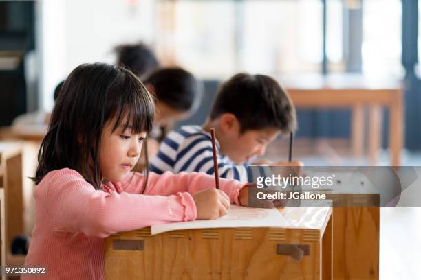 young group of students in an arts and crafts class - childhood stock pictures, royalty-free photos & images