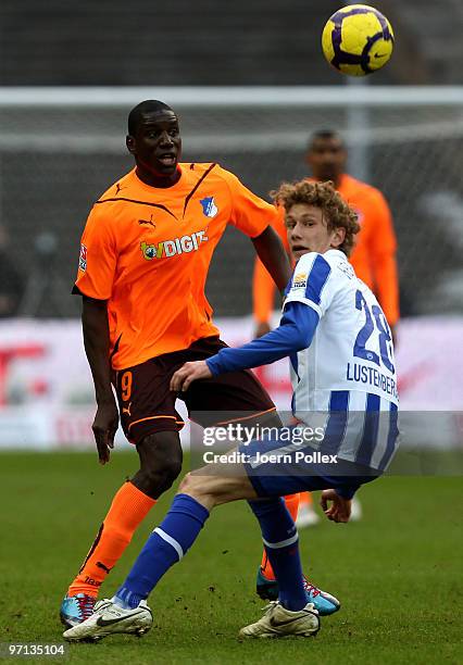 Fabian Lustenberger of Berlin and Demba Ba of Hoffenheim battle for the ball during the Bundesliga match between Hertha BSC Berlin v 1899 Hoffenheim...