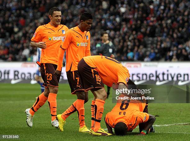 Demba Ba of Hoffenheim celebrates with his team mates after scoring his team's first goal during the Bundesliga match between Hertha BSC Berlin v...