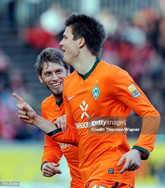 Sebastian Proedl of Bremen celebrates after scoring the 2:1 with his team mate Aaron Hunt during the Bundesliga match between FSV Mainz 05 and SV...