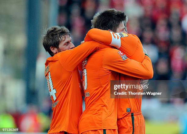 Sebastian Proedl of Bremen celebrates after scoring the 2:1 with his team mates Per Mertesacker and Aaron Hunt during the Bundesliga match between...