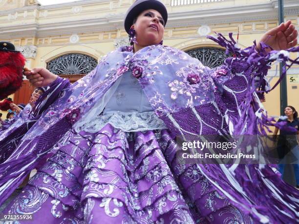 Woman in traditional dress dancing in the grand parade, in the downtown of Lima, for the 69th anniversary of the National Superior School of Folklore...