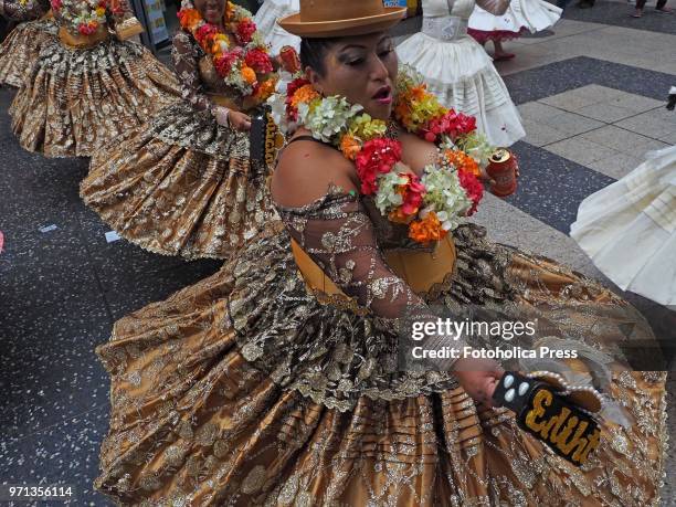 Woman in traditional dress dancing in the grand parade, in the downtown of Lima, for the 69th anniversary of the National Superior School of Folklore...