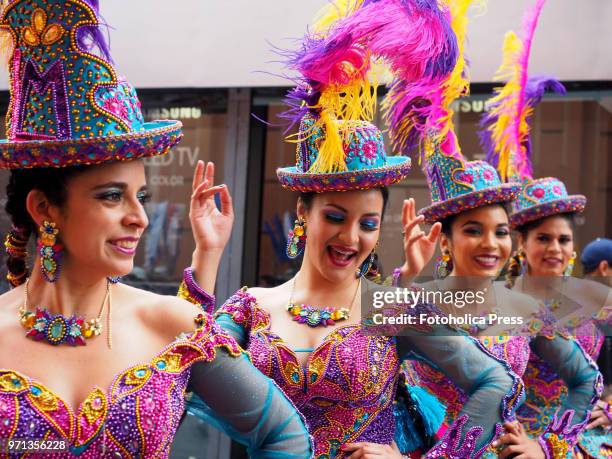 Group of girls in traditional dress dancing "Morenada" during the grand parade, in the downtown of Lima, for the 69th anniversary of the National...