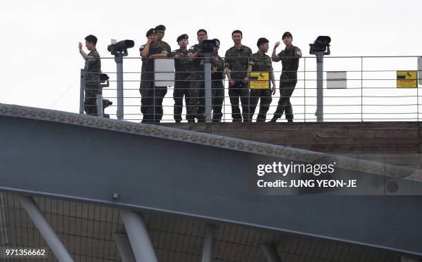 South Korean soldiers stand at a viewing deck of the Imjingak peace park near the Demilitarised Zone dividing the two Korea's in the border city of...