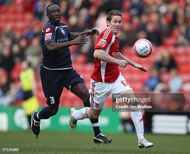 Damion Steward of QPR tries to tackle Chris Killen of Middlesbrough during the Coca-Cola Championship match between Middlesbrough and Queens Park...