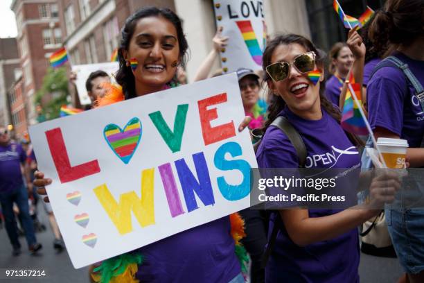 Revelers participate in the Philadelphia LGBT Pride Parade through the city's "Gayborhood" and downtown historic district.
