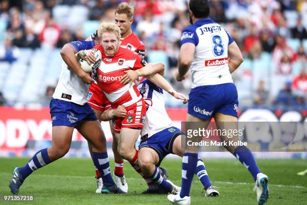 James Graham of the Dragons is tackled during the round 14 NRL match between the Canterbury Bulldogs and the St George Illawarra Dragons at ANZ...