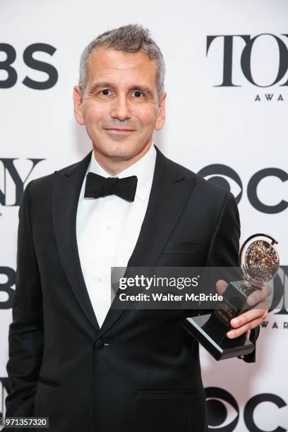 David Cromer, winner of the award for Best Direction of a Musical for 'The Band's Visit,' poses in the 72nd Annual Tony Awards Press Room at 3 West...