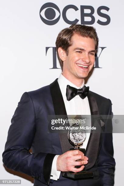 Andrew Garfield, winner of the award for Best Actor in a Play, for 'Angels in America', poses in the 72nd Annual Tony Awards Press Room at 3 West...