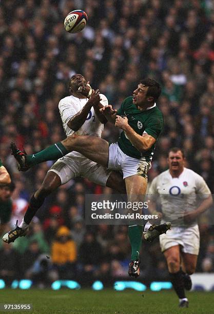 Ugo Monye of England and Tommy Bowe of Ireland challenge for the ball in the air during the RBS Six Nations match between England and Ireland at...