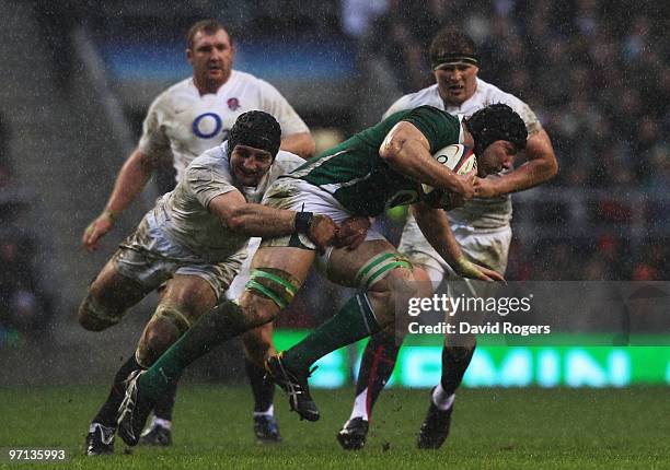 Steve Borthwick of England tackles Stephen Ferris of Ireland during the RBS Six Nations match between England and Ireland at Twickenham Stadium on...