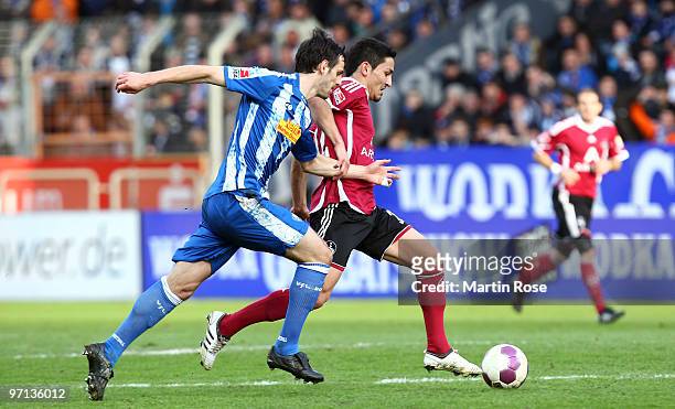 Mergim Mavraj of Bochum and Ilkay Guendogan of Nuernberg compete for the ball during the Bundesliga match between VFL Bochum and 1. FC Nuernberg at...