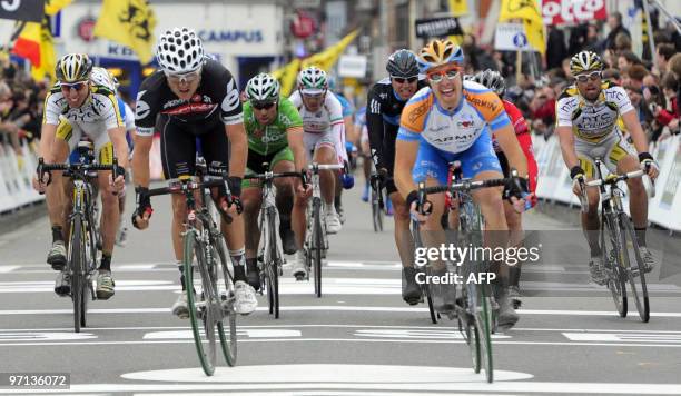 Second placed German-Australian Heinrich Haussler of team Cervelo, and third placed American Tyler Farrar of team Garmin sprint to the finish of the...