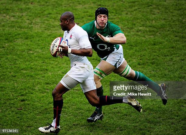 Ugo Monye of England is tackled by Stephen Ferris of Ireland during the RBS Six Nations match between England and Ireland at Twickenham Stadium on...