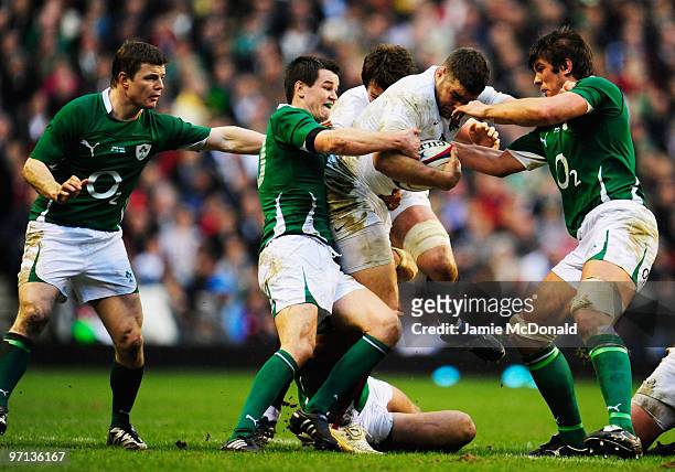 Nick Easter of England takes on Jonathan Sexton and Donncha O'Callaghan of Ireland during the RBS Six Nations match between England and Ireland at...