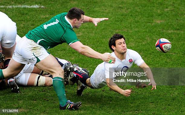 Danny Care of England gets the ball away under pressure from Cian Healy of Ireland during the RBS Six Nations match between England and Ireland at...