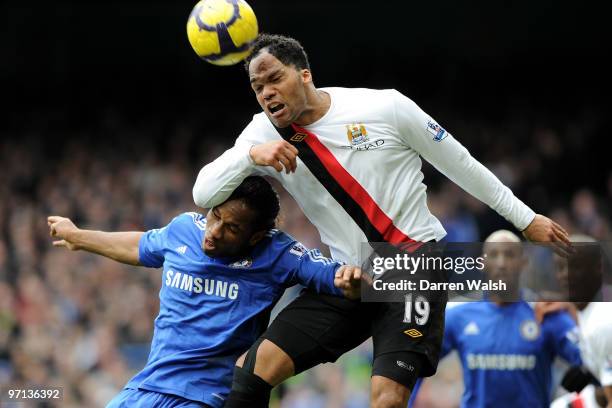 Didier Drogba of Chelsea and Joleon Lescott of Manchester City battle for the header during the Barclays Premier League match between Chelsea and...