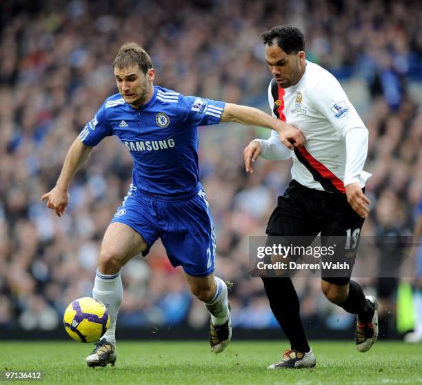 Branislav Ivanovic of Chelsea and Joleon Lescott of Manchester City battle for the ball during the Barclays Premier League match between Chelsea and...