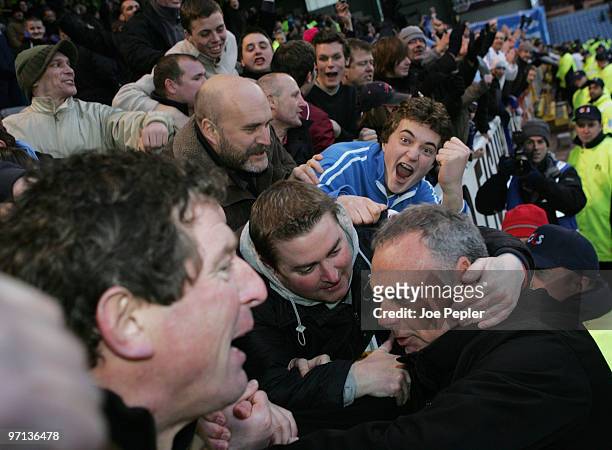 Manager Avram Grant of Portsmouth celebrates their win with fans after the Barclays Premier League match between Burnley and Portsmouth at Turf Moor...
