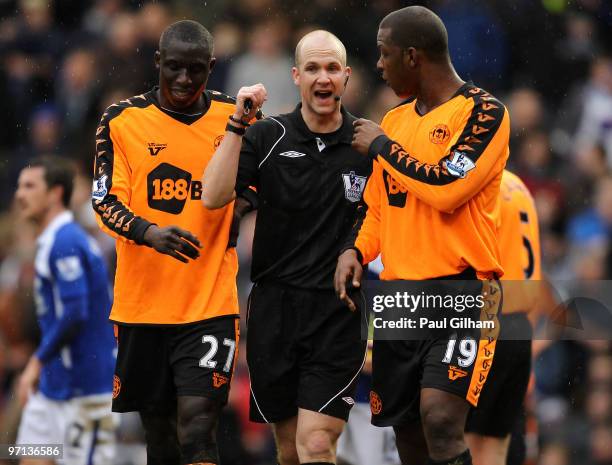 Mohamed Diame and Titus Bramble of Wigan Athletic speak to referee Anthony Taylor after he awarded Birmingham City a penalty during the Barclays...