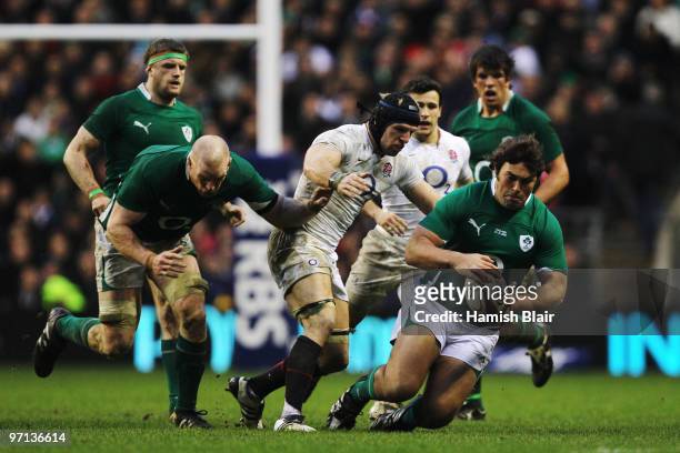 Tony Buckley of Ireland is tackled by James Haskell of England during the RBS Six Nations match between England and Ireland at Twickenham Stadium on...