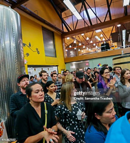 Guests attend the GenR: LA Force for Change Photo Exhibition hosted by GenR and the International Rescue Committee at GreenBar Distillery on June 7,...