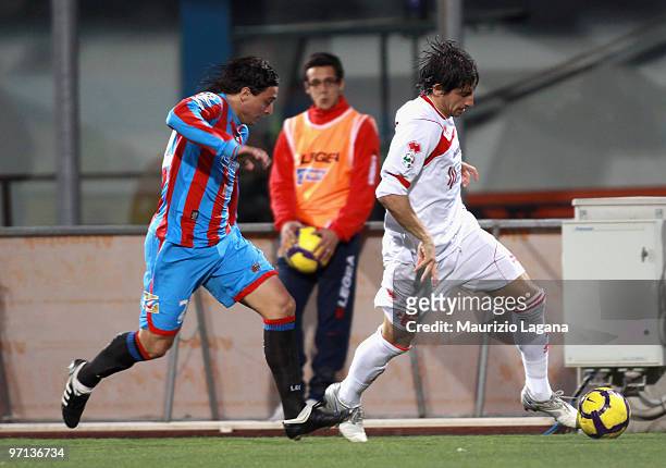 Pablo Alvarez of Catania Calcio battles for the ball with Jose' Castillo of AS Bari during the Serie A match between Catania and Bari at Stadio...