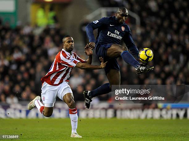 Sol Campbell of Arsenal beats Ricardo Fuller of Stoke City to the ball during the Barclays Premier League match between Stoke City and Arsenal at The...