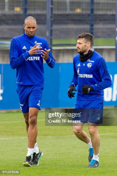 Naldo of Schalke and Daniel Caligiuri of Schalke run during a training session at the FC Schalke 04 Training center on April 3, 2018 in...
