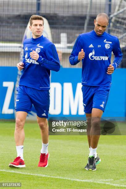 Matija Nastasic of Schalke and Naldo of Schalke run during a training session at the FC Schalke 04 Training center on April 3, 2018 in Gelsenkirchen,...