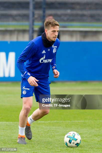 Bastian Oczipka of Schalke controls the ball during a training session at the FC Schalke 04 Training center on April 3, 2018 in Gelsenkirchen,...