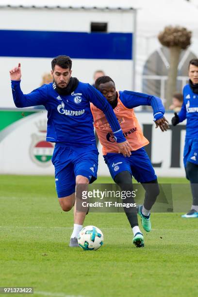Pablo Insua of Schalke and Bernard Tekpetey of Schalke battle for the ball during a training session at the FC Schalke 04 Training center on April 3,...