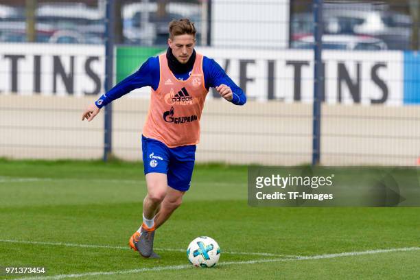 Bastian Oczipka of Schalke controls the ball during a training session at the FC Schalke 04 Training center on April 3, 2018 in Gelsenkirchen,...