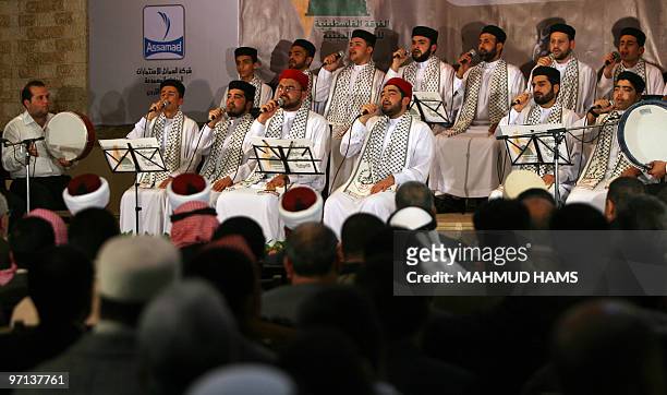 Members of the Palestinian Muslim Religious Eulogy Band sing songs during a festival to mark the birthday of the Prophet Mohammad in Gaza City on...