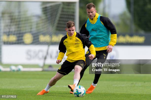 Sergio Gomez of Dortmund and Andrey Yarmolenko of Dortmund battle for the ball during a training session at BVB trainings center on May 1, 2018 in...