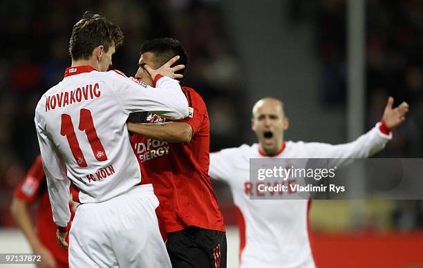 Milivoje Novakovic of Koeln and Arturo Vidal of Leverkusen fight during the Bundesliga match between Bayer Leverkusen and 1. FC Koeln at BayArena on...