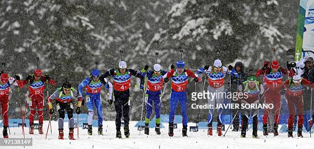 Athletes take the start of the men's Biathlon 4 x 7.5 km relay at Whistler Olympic Park during the Vancouver Winter Olympics on February 26, 2010....