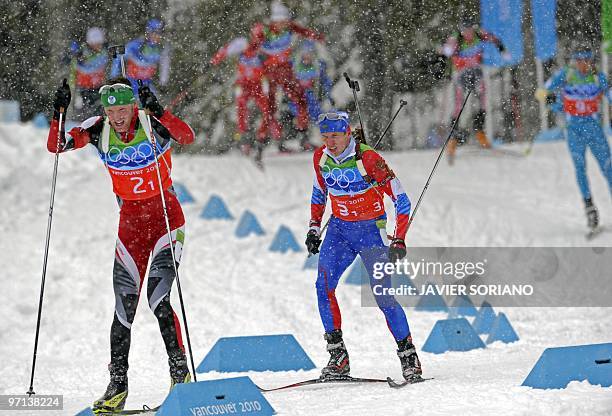 Austria's Simon Eder and Rusia's Ivan Tcherezov compete in the men's Biathlon 4 x 7.5 km relay at Whistler Olympic Park during the Vancouver Winter...