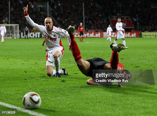 Renato Augusto of Leverkusen falls after a battle with Miso Brecko of Koeln during the Bundesliga match between Bayer Leverkusen and 1. FC Koeln at...