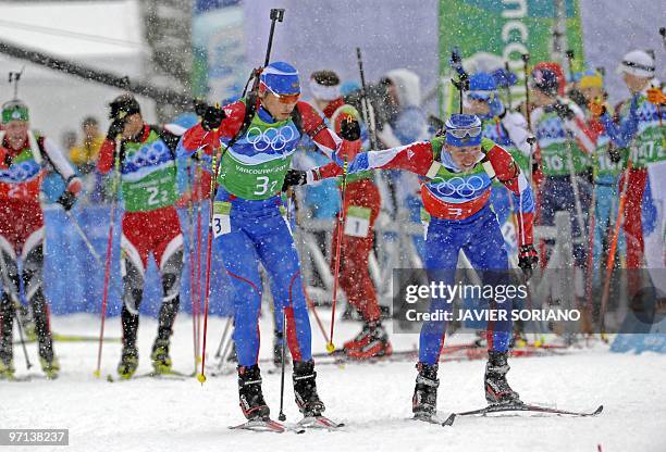 Rusia's Ivan Tcherezov gives the relay teammate Anton Shipulin in the men's Biathlon 4 x 7.5 km relay at Whistler Olympic Park during the Vancouver...