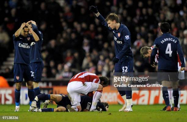 Aaron Ramsey of Arsenal lies seriously injured following a challenge by Ryan Shawcross of Stoke City during the Barclays Premier League match between...