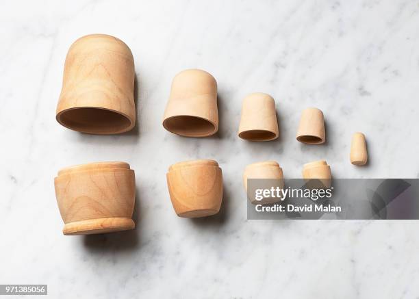 open russian nesting doll laid out on a marble surface. - russian doll stock pictures, royalty-free photos & images
