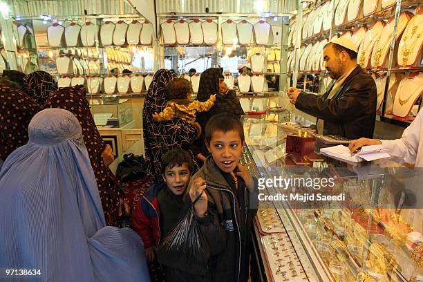 People look at gold in a jewelry shop February 27, 2010 in Herat, Afghanistan. As the ongoing war in Afghanistan enters its ninth year the...