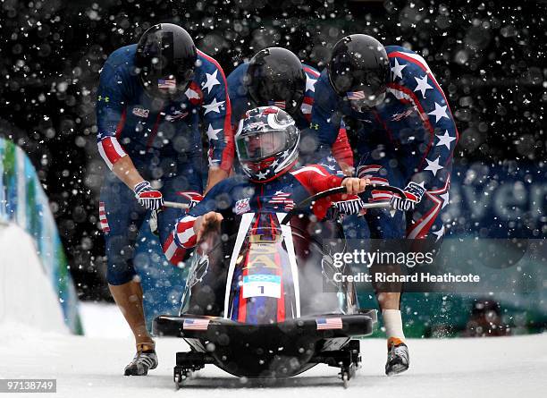 Steven Holcomb, Justin Olsen, Steve Mesler and Curtis Tomasevicz of the United States compete in USA 1 during the four-man bobsleigh on day 15 of the...