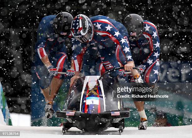 Steven Holcomb, Justin Olsen, Steve Mesler and Curtis Tomasevicz of the United States compete in USA 1 during the four-man bobsleigh on day 15 of the...