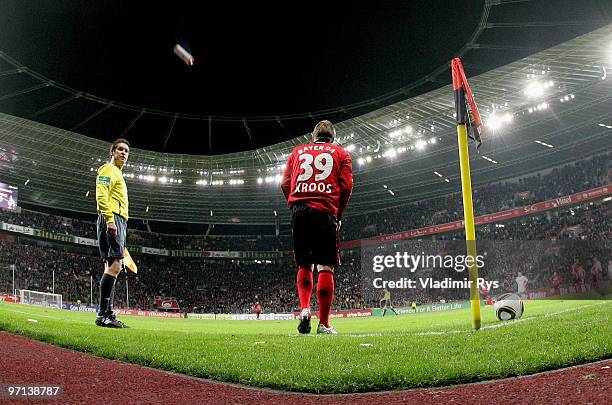 Signal flare thrown from Koeln fans is seen as Toni Kroos of Leverkusen prepares to execute a corner kick during the Bundesliga match between Bayer...