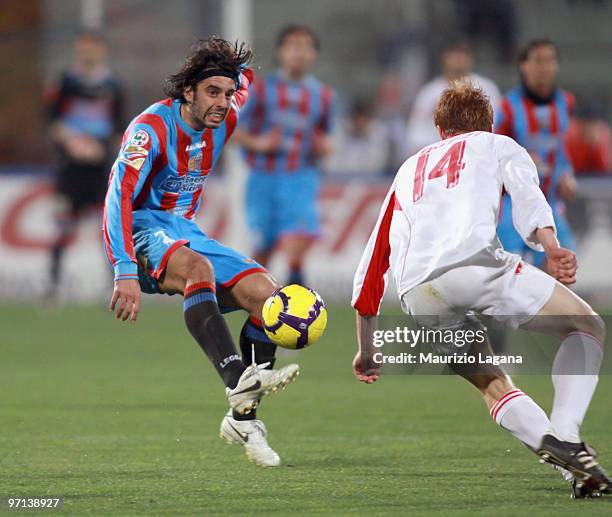 Jorge Matrinez of Catania Calcio battles for the ball with Alessandro Gazzi of AS Bari during the Serie A match between Catania and Bari at Stadio...